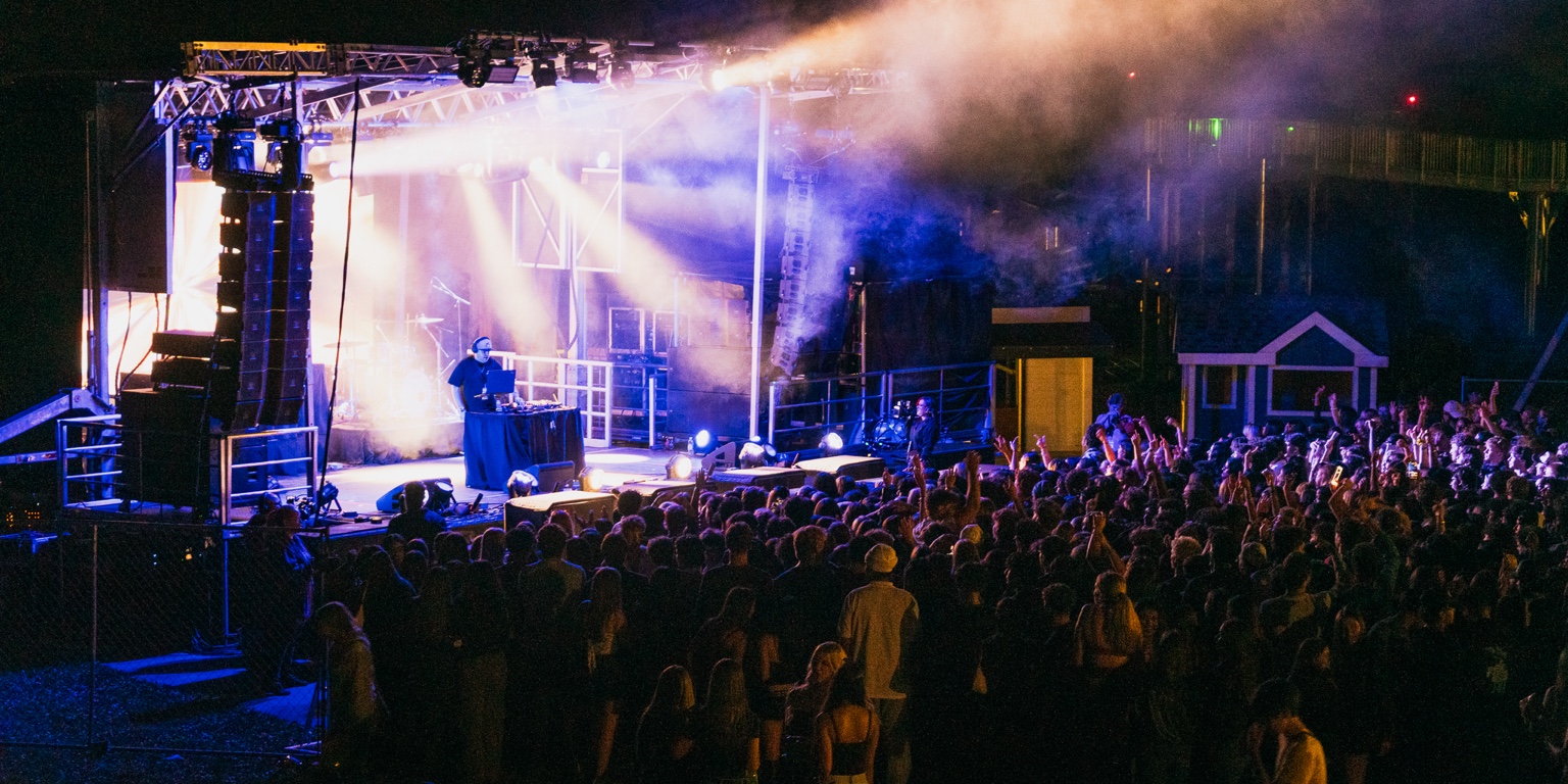 DJ Order 66 performing on stage in front of a concert crowd